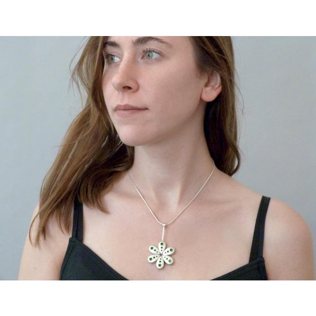 This unique necklace was hand fabricated by artist Carrie Hoffnagle, (I Build Pretty Things), with sterling silver and...