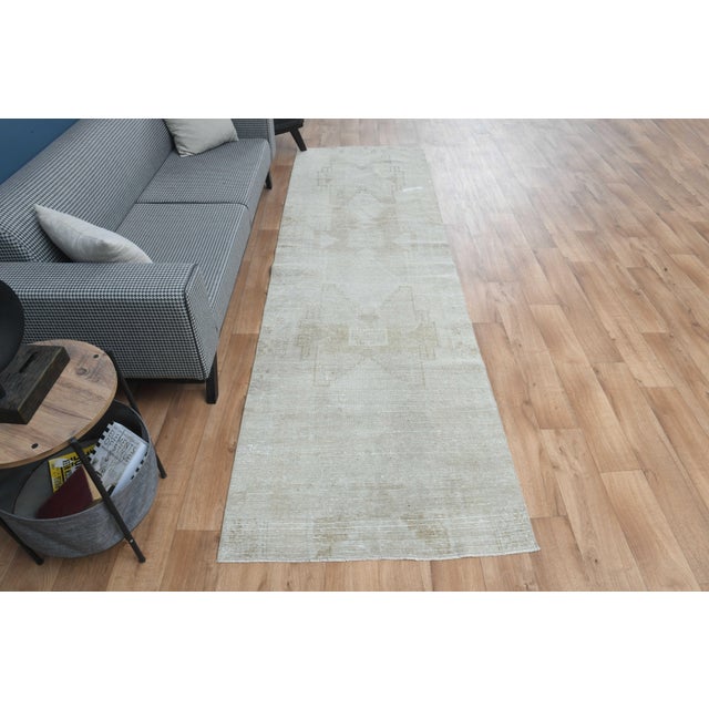 This vintage hand-knotted area rug is a semi-antique vintage area rug. The '70s Eastern region of Anatolian's unique rug...