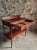 Antique mahogany console table dating from around 1900, originating from France. The piece features a large full-width...