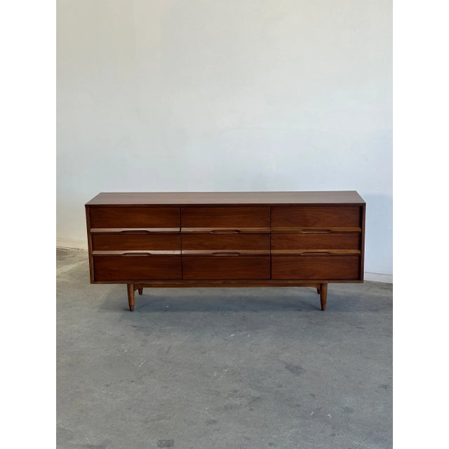 W72 D17.5 H30.5 Vintage triple dresser in refinished condition. Unit has original sculpted handles, bottom base and legs...