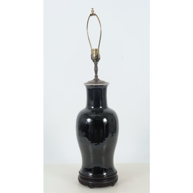 Chinese late Qing mirror black porcelain baluster vase mounted as a table lamp. Tall vase with elegant proportions....