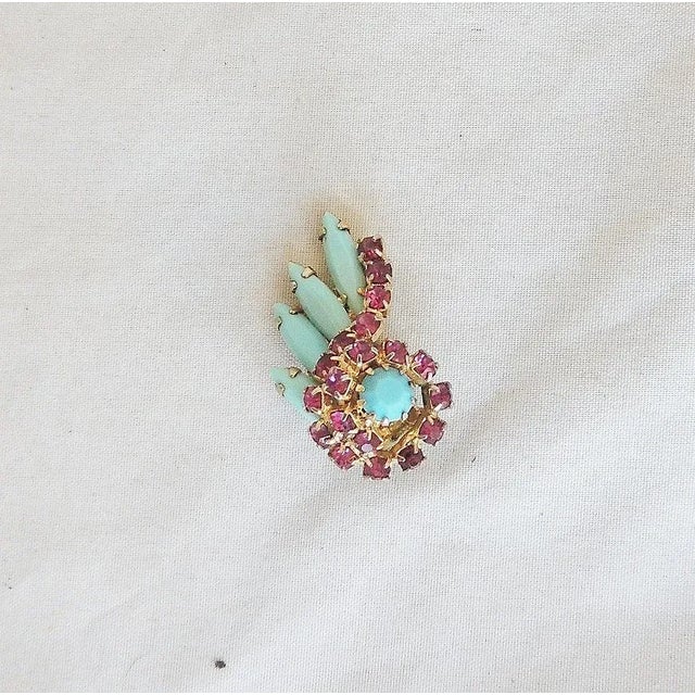 This is part of Chairish’s Costume Jewelry assortment. Goldtone faux-turquoise and faux-ruby paste clip back earrings....