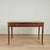 Handsome early 19th century English desk or writing table handcrafted in mahogany with a tooled green leather top on a...