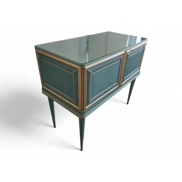 Umberto Mascagni 1950s two-door buffet with internal mirrors, in petrol green and black vinyl, aluminum inserts, set in...