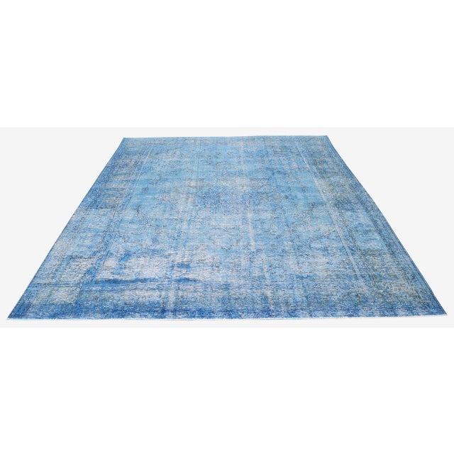 Hand-knotted with care using traditional rug-making techniques, this wool rug blends timeless craftsmanship with a modern...