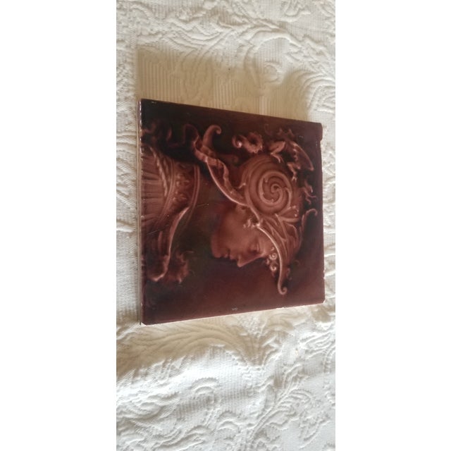 Rare Antique Victorian PortraitTile of a male dressed in Renaissance style dress wearing a very decorative helment iand...