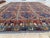 This vintage rug is hand-knotted in wool, woven in Afghanistan in the Ersari Turkomen tribal design tradition. Measuring...
