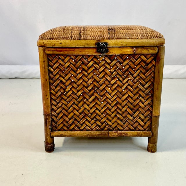 This is a wonderful rattan, wicker and bamboo one-person storage Bench. It has a woven wicker upholstered padded seat than...