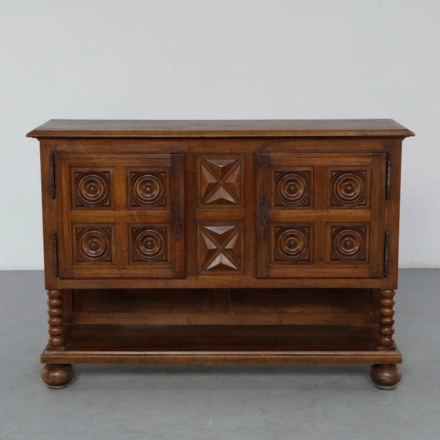 This exceptional 1940s Brutalist French oak sideboard, executed in the distinctive manner of legendary designer Charles...