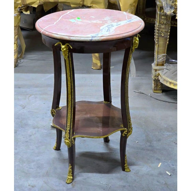 Introduce timeless French sophistication into your home with this exquisite Louis XVI-inspired side table, masterfully...