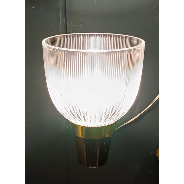 An elegant wall light, Model LP5, designed by Ignazio Gardella for Azucena in the 1950s and 1960s. The glass shade...