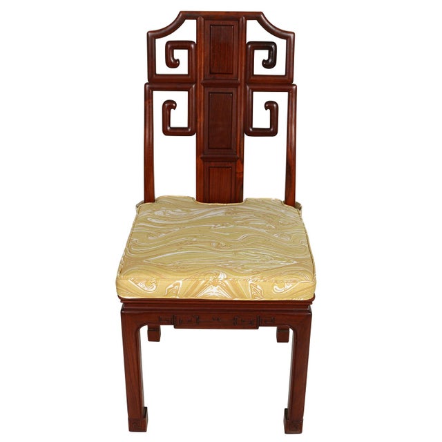 Set of four Chinese Chippendale inspired rosewood dining chairs with Meg Braff's custom ochre Marbled fabric cushions. The...