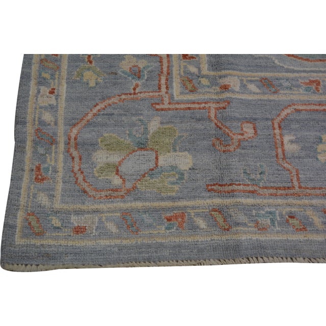 Turkish Oushak Hand-knotted with care using traditional rug-making techniques, this wool rug blends timeless craftsmanship...