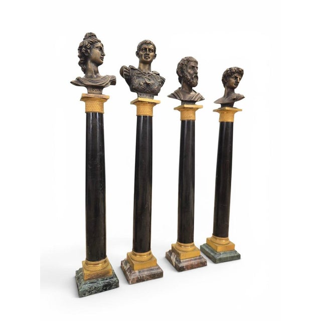 Exceptional set of four decorative columns crafted during the 19th century, combining black marble, finely cast gilt...