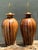 This striking pair of vintage table lamps exemplifies the refined elegance of mid-century design, combining richly striped...
