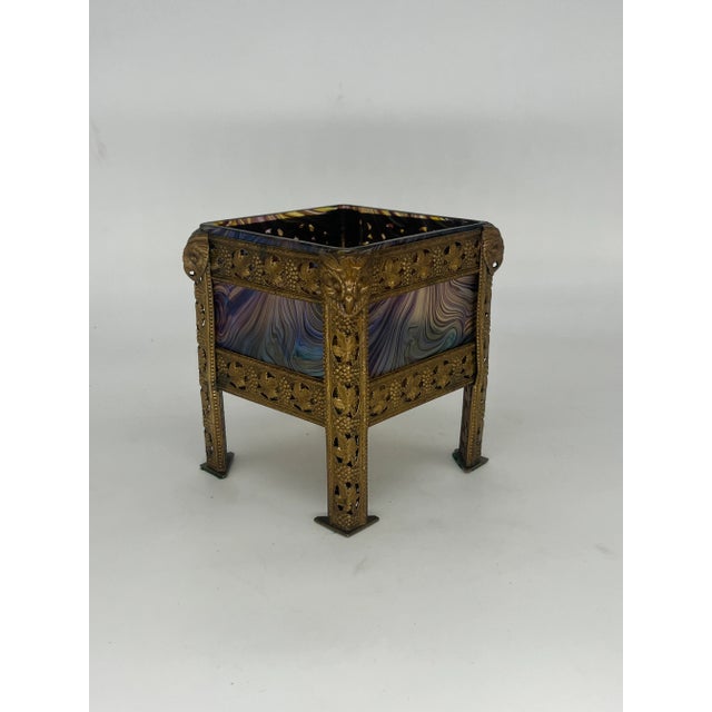 A stunning Art Nouveau era art glass vase produced in Austria or Bohemia. Possibly by Loetz. The vase or cache pot is...