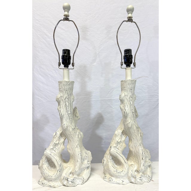 Great pair of Italian style faux bois table lamps from the early 21st century. They are made of a composite material and...