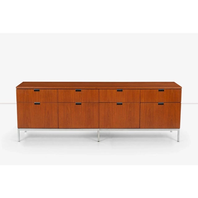 Florence Knoll Eight-Drawer Credenza in Teakwood, features Notch pulls with chrome details, Four file drawers and Four...