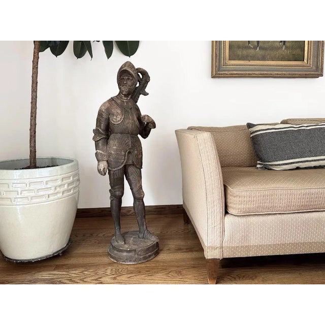 Bring old world charm into your space with this antique French terracotta garden statue of a knight. The aged patina of...