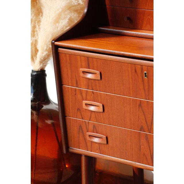 Vintage Danish Teak Secretary Desk: Scandinavian Elegance and Design Looking for a beautiful and practical retro piece of...