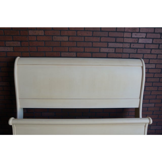 A modern take on a traditional sleigh bed. This queen size Chloe bed was finely crafted by Ethan Allen in Vermont. The...
