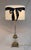 A stunning, elegant pair of mid-century crystal column table lamps accented with brass and bronze fittings in the style of...
