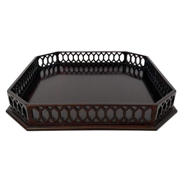 This Vintage Chippendale-Style Fretwork Octagonal Mahogany Tray is a charming and unique desktop collectible piece....