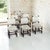 A set of six 19th century Renaissance Revival dining chairs in oak, crowned with carved lion finials and raised on barley...