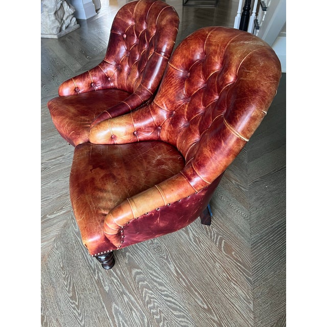 A stunning pair of vintage petite George Smith Chesterfield chairs. Tufted leather with rich patina and fabulous nailhead...