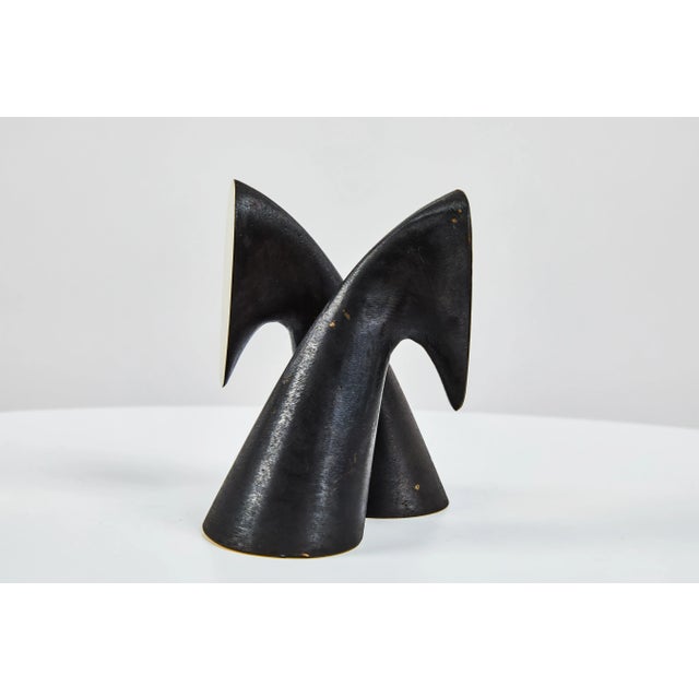 Pair of Carl Auböck model #3654 brass bookends. Designed in the 1950s, this incredibly refined and sculptural pair of...