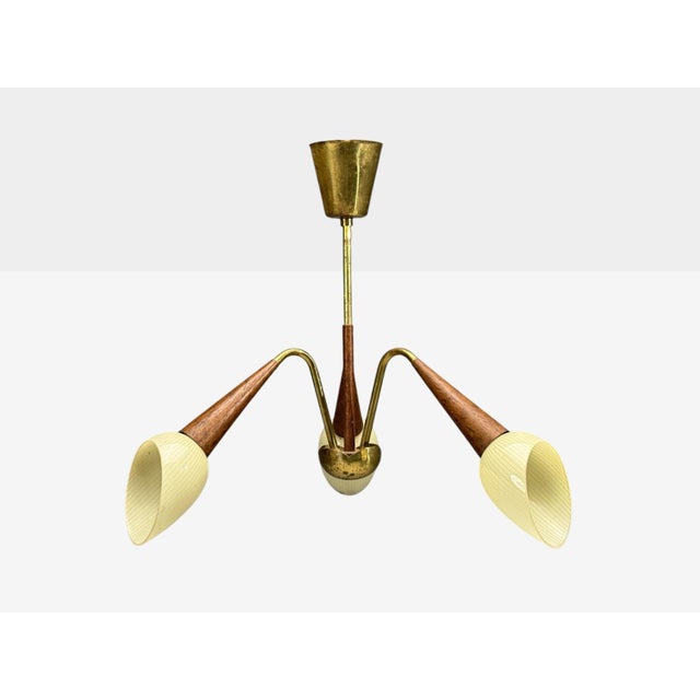 Swedish Mid-Century Modern, Pendant Light, Brass, Wood, Glass, Sweden, 1920s A three arm metal and wood pendant light or...