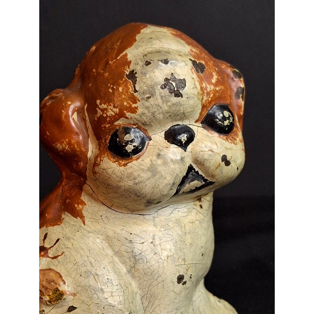 Offered here is a highly collectible 1920s antique cast iron "Puppo" doorstop manufactured by the Hubley Manufacturing...