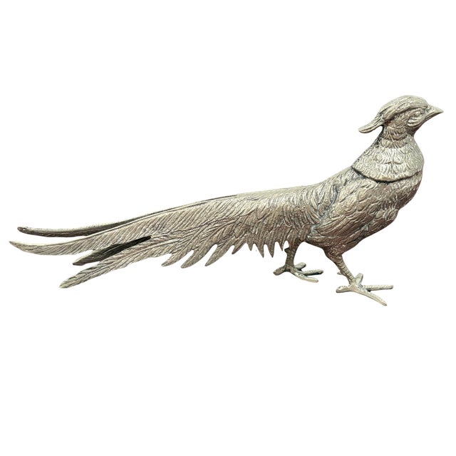 A striking vintage Gucci decorative pheasant figurine, made in Italy and rendered in richly detailed silver-tone metal....