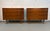 Bring timeless style and functionality to your space with this striking pair of Mid-Century Modern walnut dressers....