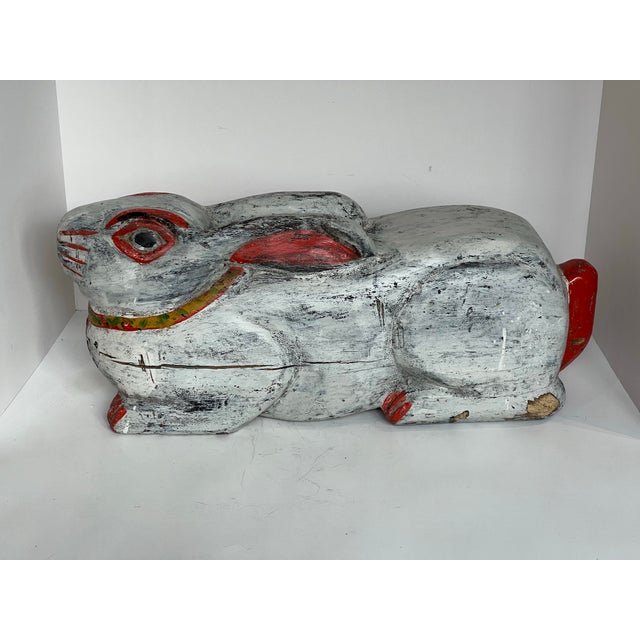 Charming vintage Balinese hand-carved wooden rabbit sculpture, crafted in Indonesia and finished with traditional hand-...
