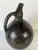 Striking vintage handmade pottery vase featuring a sculptural organic silhouette with an elongated neck and integrated...