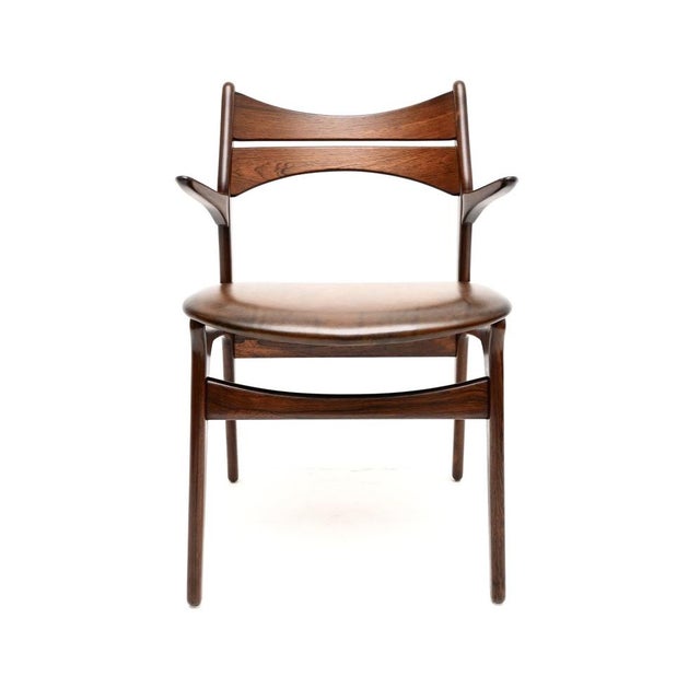 A stylish and incredibly well made Danish vintage carver desk chair / armchair by Erik Buch. This was made in Denmark by...