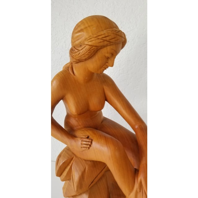 Incredible Vintage hand carved wood nude woman sculpture. This beautiful art carved wood sculpture is just incredible as...