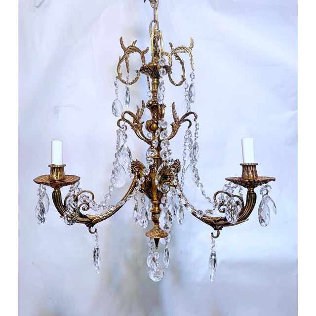 This is a Italian style brass chandelier with vintage style crystals and octagon chain. It has 3 arms that each use a 60W...