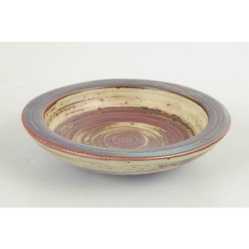 Kresten Bloch for Royal Copenhagen Bowl / Dish, 1970s. Low stoneware bowl featuring a pronounced concentric pattern and a...