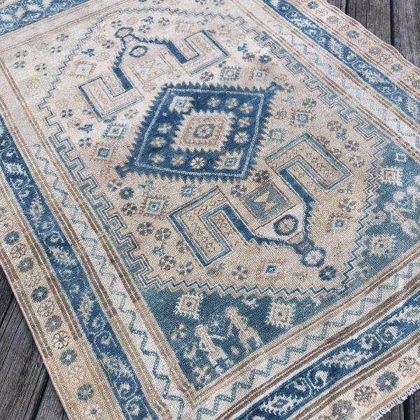 A beautifully aged antique rug defined by its soft, luminous palette and richly layered design. Woven approximately 100...