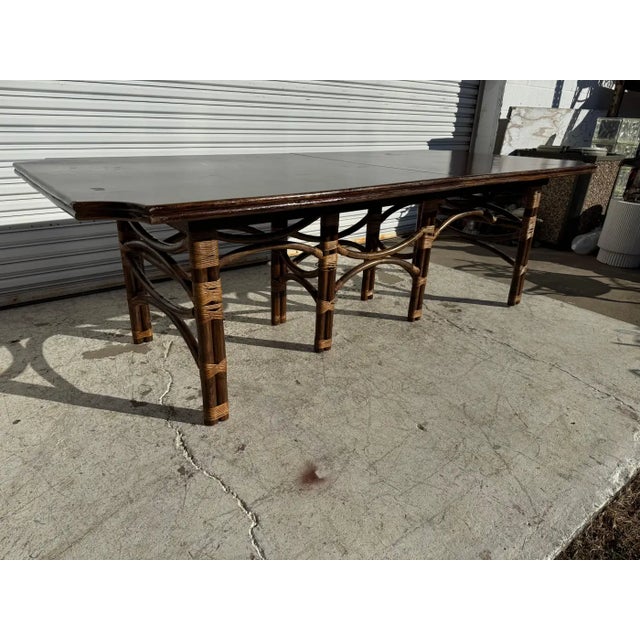 This dining table showcases a hand-finished teak top with a warm, even stain that highlights organic grain movement and...
