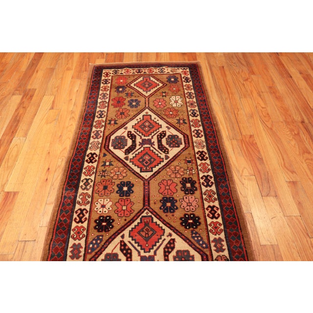 Antique Persian Serab Rug with Tribal Medallions and Warm Camelhair Tones, Country of Origin: Persia, Circa Date: 1900