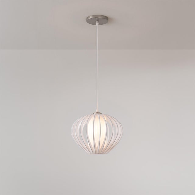 The Bloom Pendant Kit is a modern lighting fixture featuring a striking Bloom-shaped white satin steel shade, designed to...