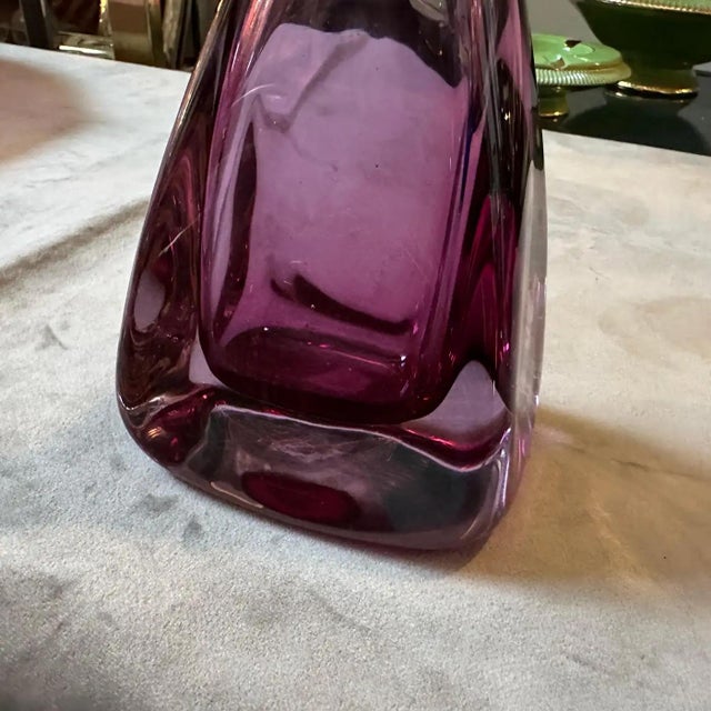 An elegant pink sommerso murano glass bottle designed in the Seventies by Flavio Poli and manufactured in Venice by...