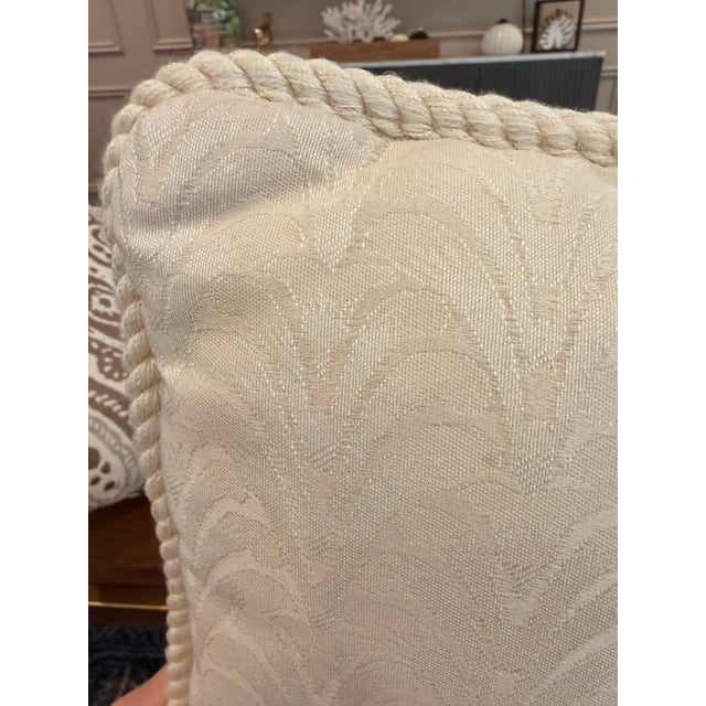 Elegant pair of custom tailored off-white accent pillows in coordinating square sizes, measuring approximately 17” x 17”...