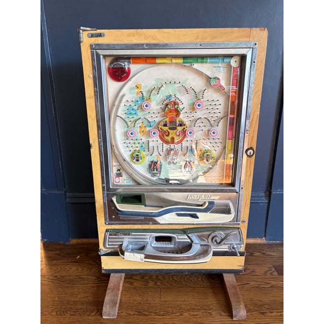 Authentic vintage Japanese pachinko machine from the Shōwa era, featuring an original wood cabinet, full mechanical...