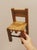 Decorative miniature chair crafted with a solid wood frame and a woven natural fibre seat and backrest. Inspired by...