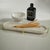 This tray has a rich and classy look and works for various purposes. Crafted from marble, this oval tray sits atop a gold...