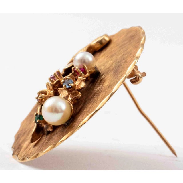 Vintage 1970s 14K yellow gold Florentine-finish, colored stones and pearl bouquet disc brooch with scalloped edge border....